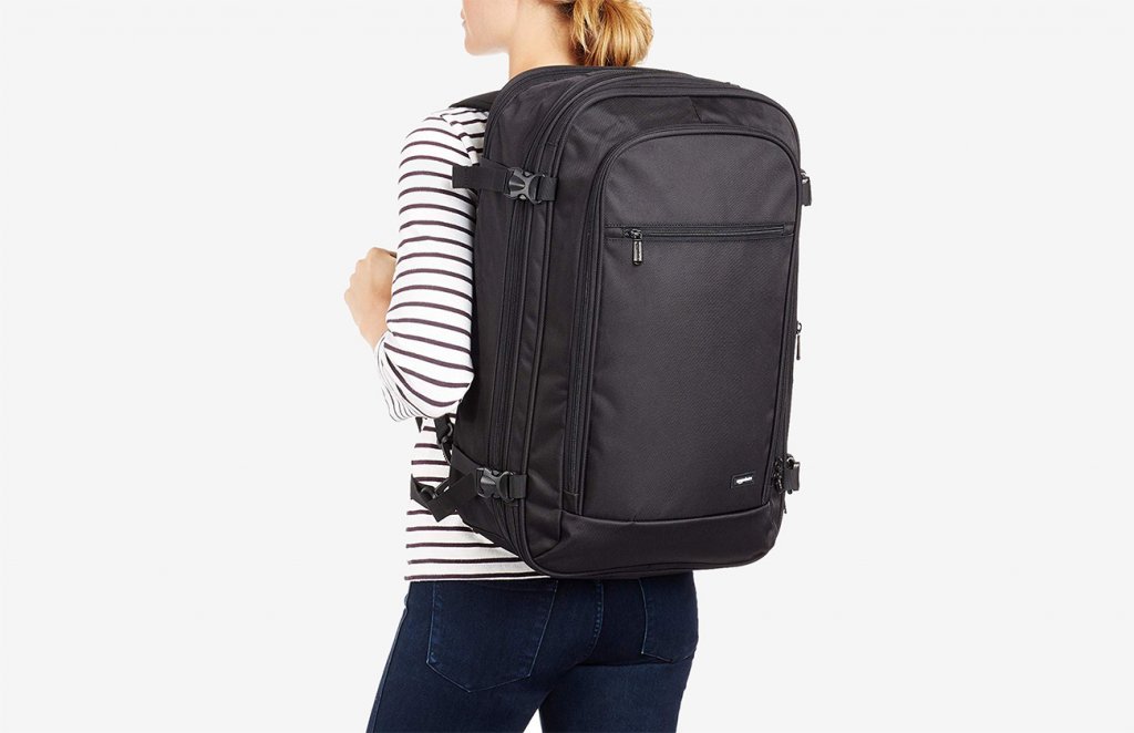 Someone carrying the AmazonBasics Carry-On Travel Backpack