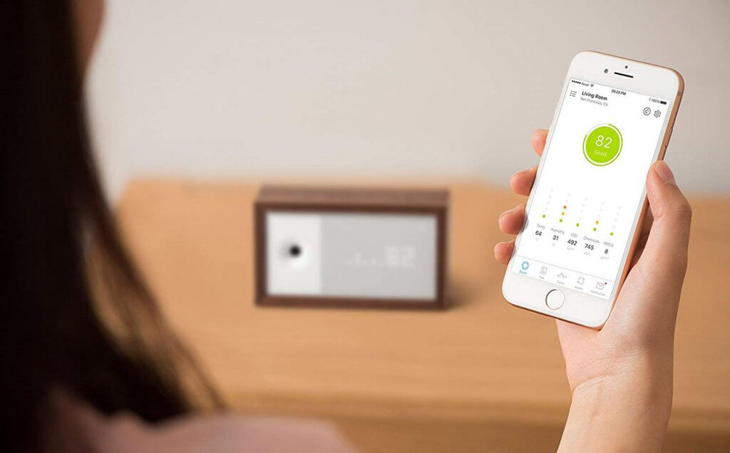 Awair 2nd Edition Air Quality Monitor and smartphone