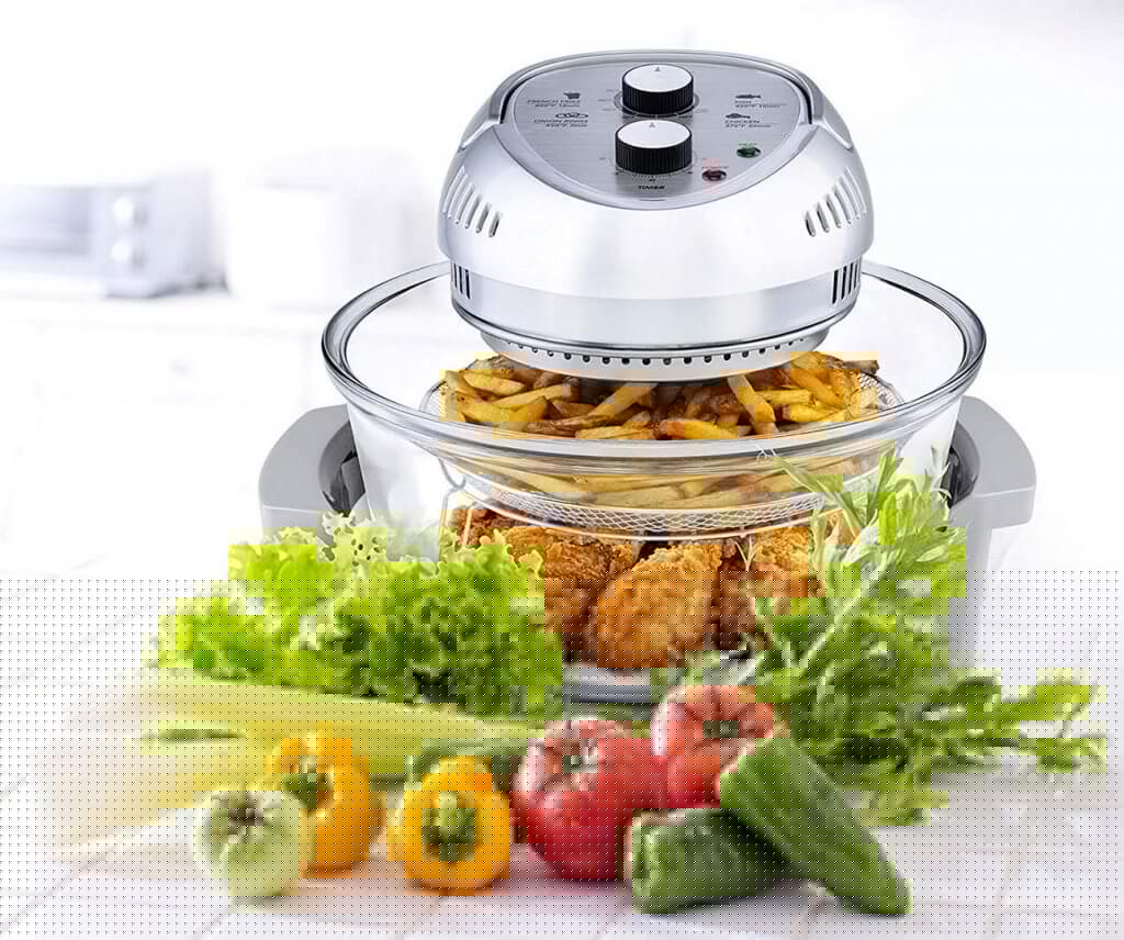 Big Boss Oil-less Air Fryer, 16 Quart High Capacity and a cooked meal