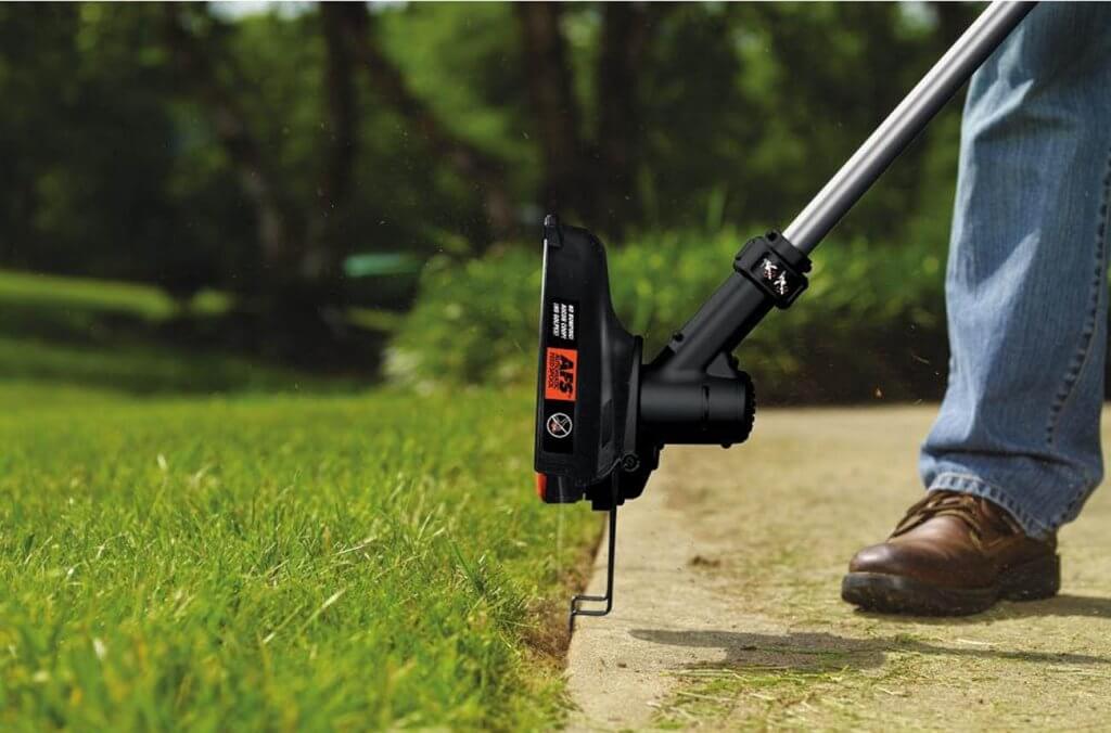 BLACK+DECKER 40V MAX 13-inch LST136 used for trimming an edge