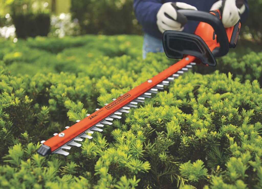 BLACK+DECKER LHT2436 used for trimming a hedge