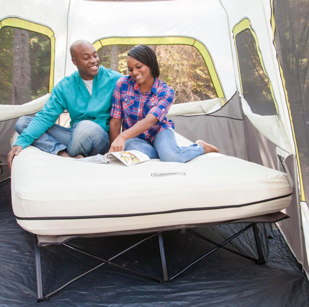 Couple on the Coleman Camping Cot, Air Mattress, and Pump Combo
