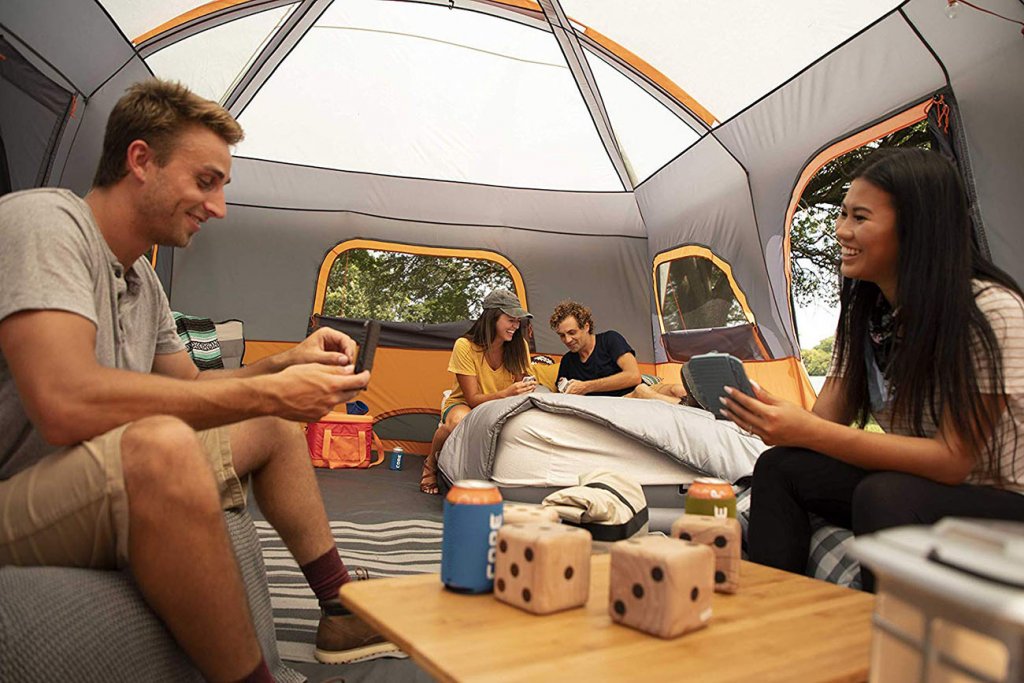 A group of friends in the CORE 12 Person Extra Large Cabin Tent