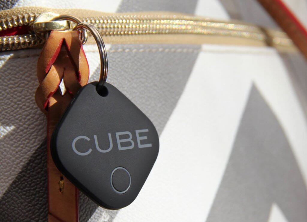 CUBE Smart Tracker on a purse