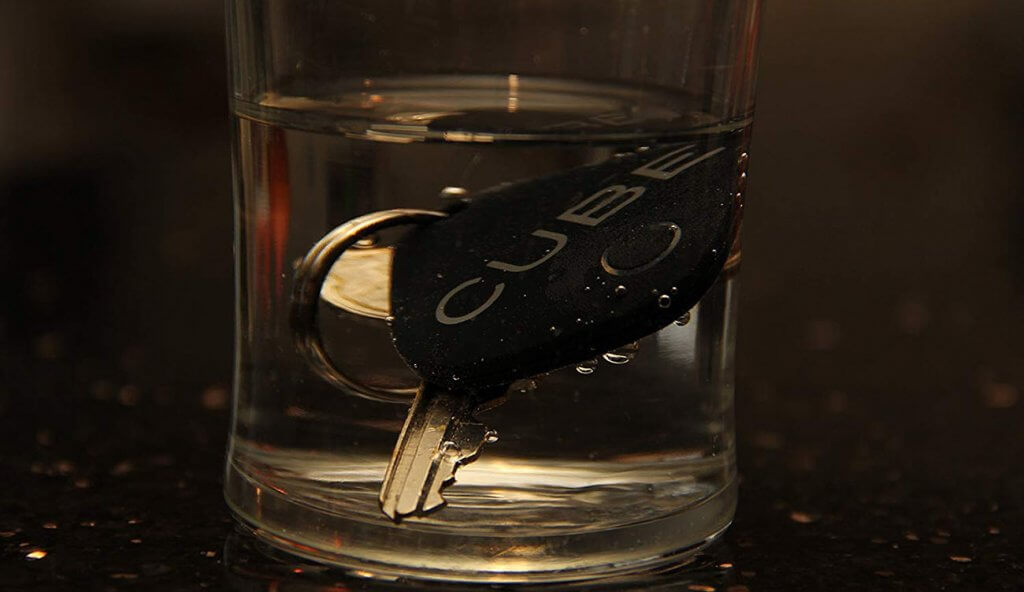 CUBE Smart Tracker in a glass of water