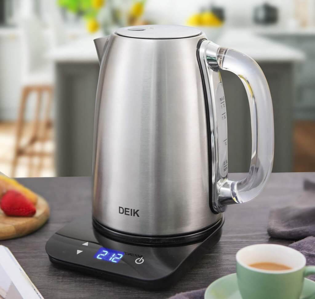 DEIK Electric Kettle in the kitchen next to a cup of coffee