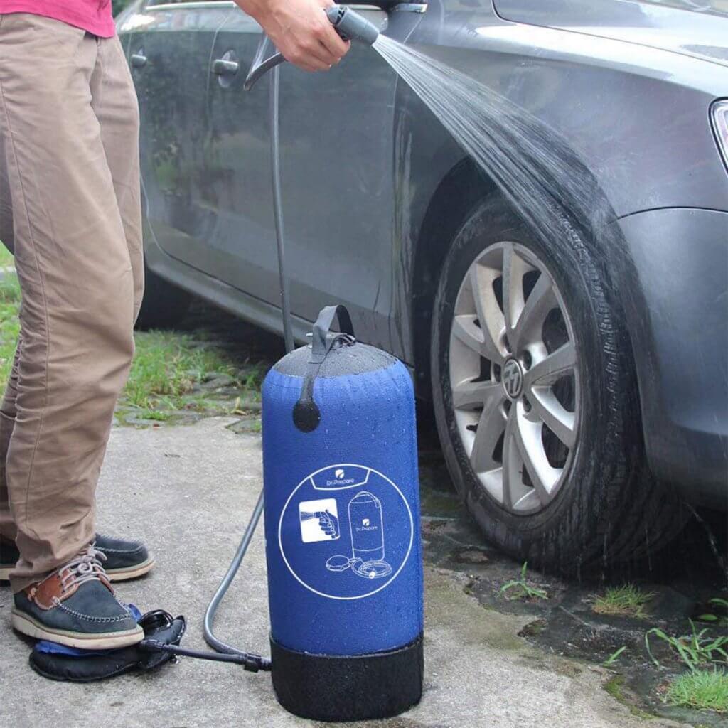 Cleaning a car with the Dr. Prepare Solar Camping Shower