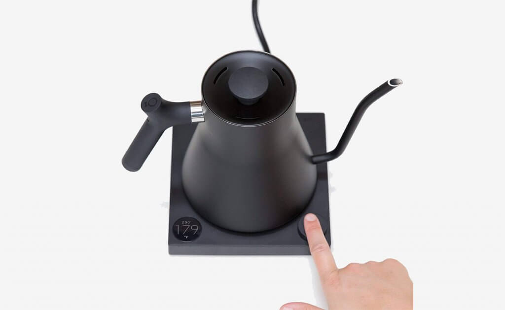 Turning on the Fellow Stagg EKG Electric Pour-Over Kettle with the push of a button