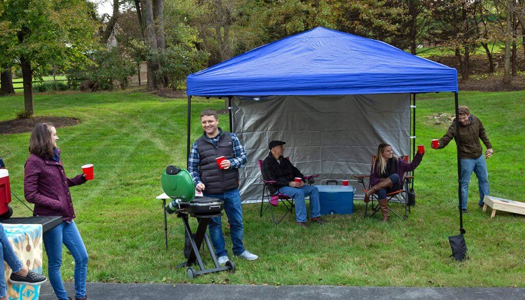 Friends doing a BBQ in the Punchau Pop-up Canopy Tent With Sidewall