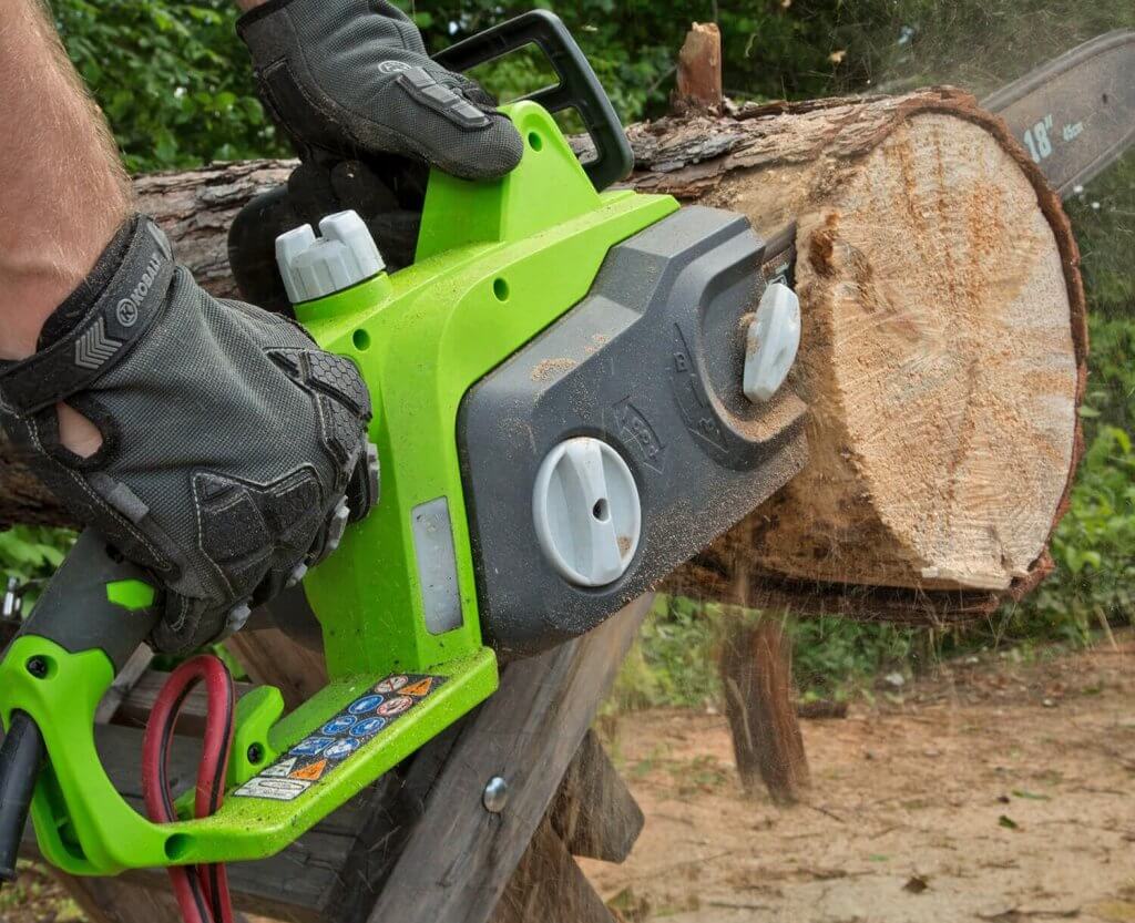 Greenworks 18-Inch Electric Chainsaw cutting a log