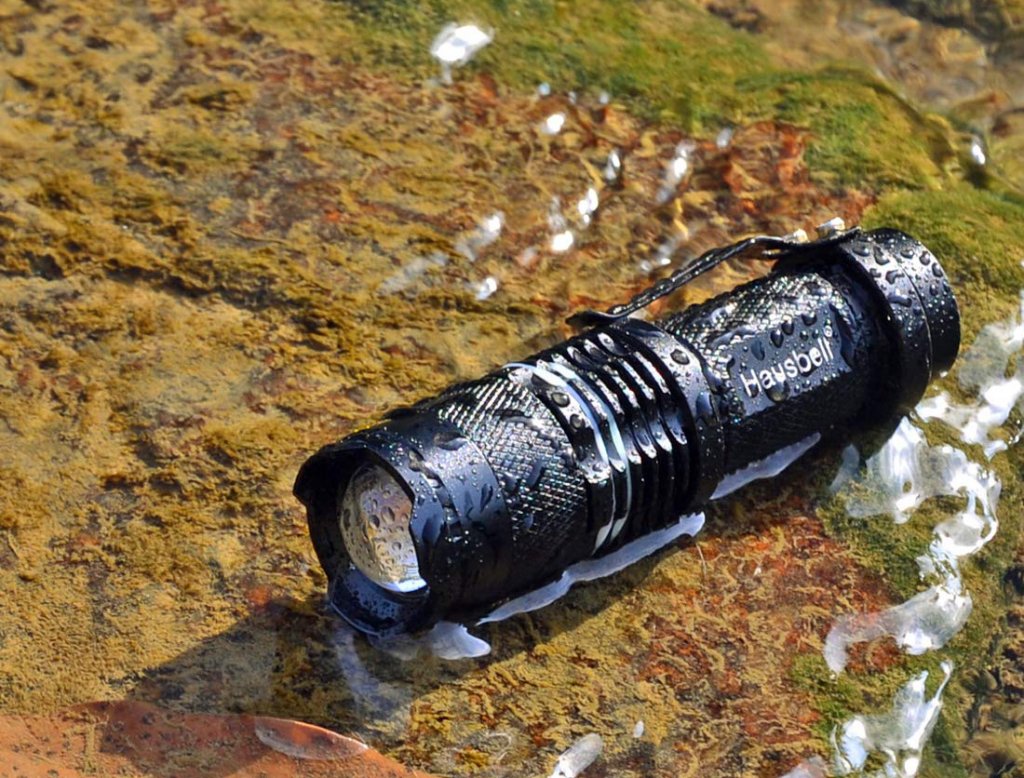 Hausbell 7W Mini LED Tactical Flashlight on a camping trip