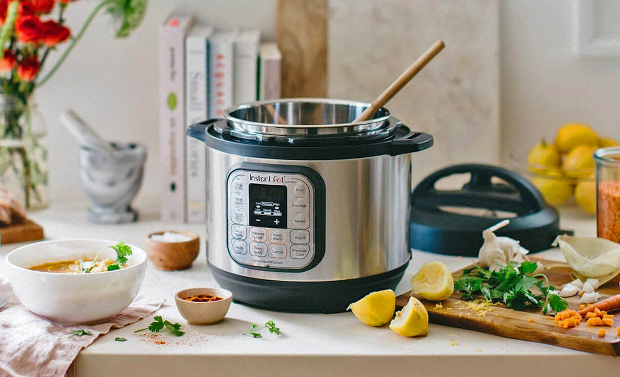 Instant-Pot-Duo-Mini-3 on a table with food