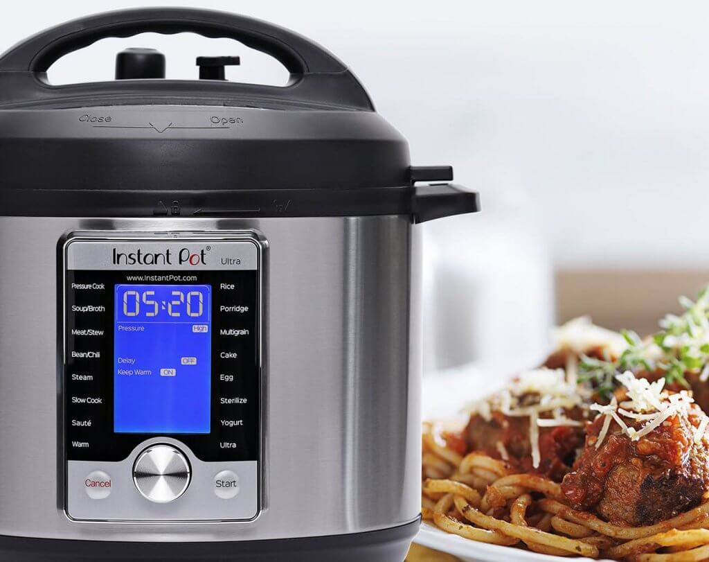 Instant Pot Ultra 10-In-1 Slow Cooker next to a meal