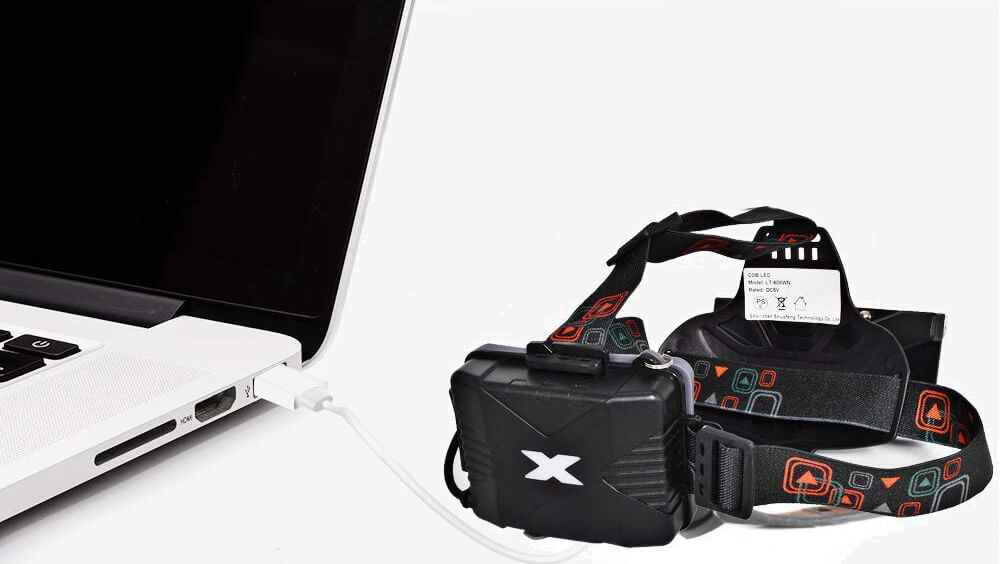 4 LETOUR COB Rechargeable Headlamp charged on a laptop