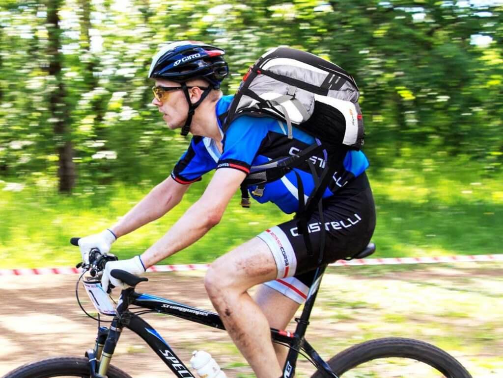 Biker wearing the Local Lion Cycling Backpack