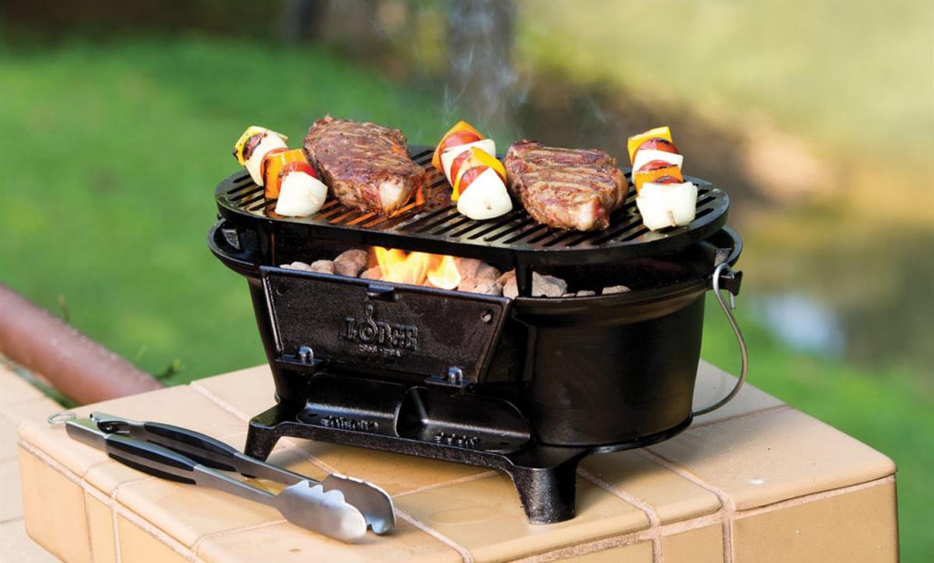 Lodge Cast Iron Sportsman's Hibachi-Style Charcoal Grill outdoors