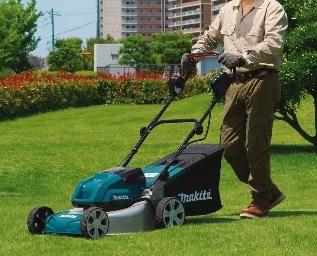Makita XML03PT1 18-Volt Cordless Lawn Mower on lawn