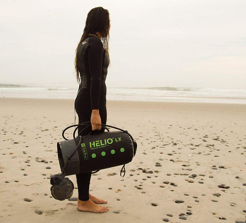 Nemo Helio Portable Pressure Shower on the beach