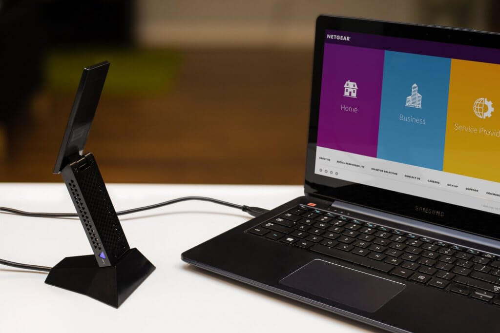 Netgear Nighthawk AC1900 A7000 WiFi USB Wireless Adapter stand and laptop