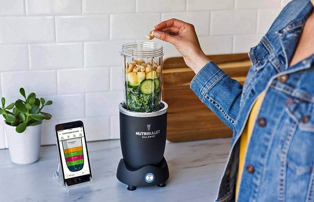 NutriBullet Balance next to a connected smartphone