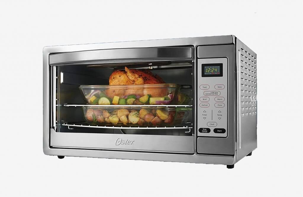Preparing chicken in the Oster Extra Large Stainless Steel Oven