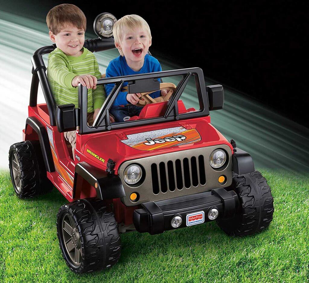 two kids in the Power Wheels Tough Talking Jeep Wrangler