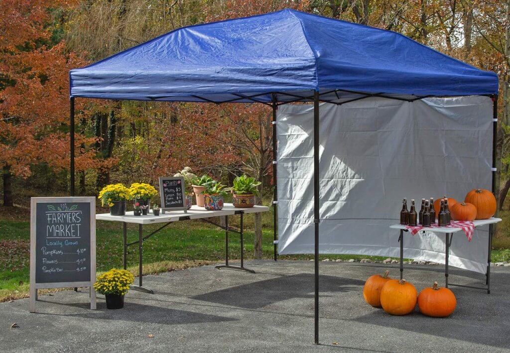 Punchau Pop-up Canopy Tent With Sidewall used for a garden sale