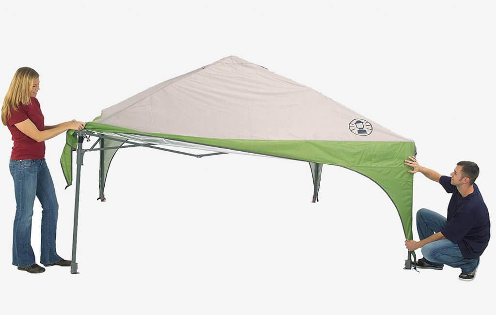 Putting the tarp on the Coleman Canopy Tent