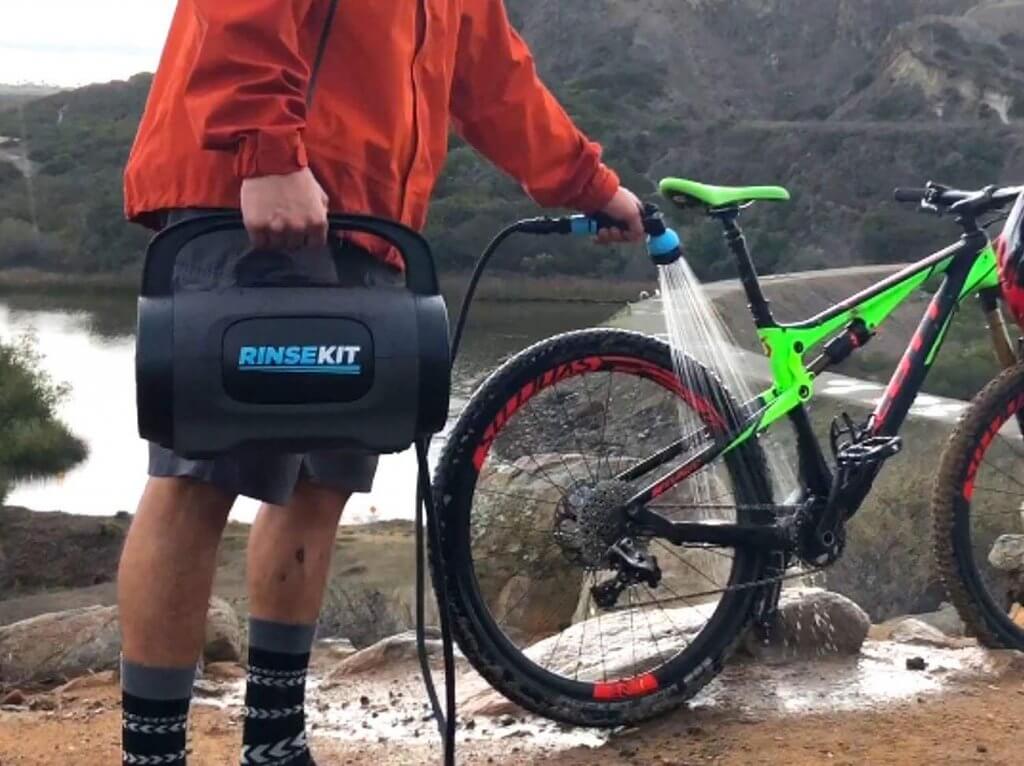 Rinse Kit POD Portable Outdoor Shower used for cleaning a bike