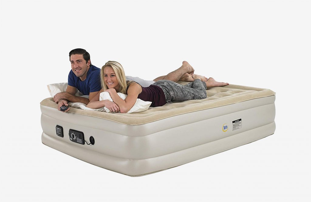 Couple on the Serta Raised Queen Pillow Top Air Mattress
