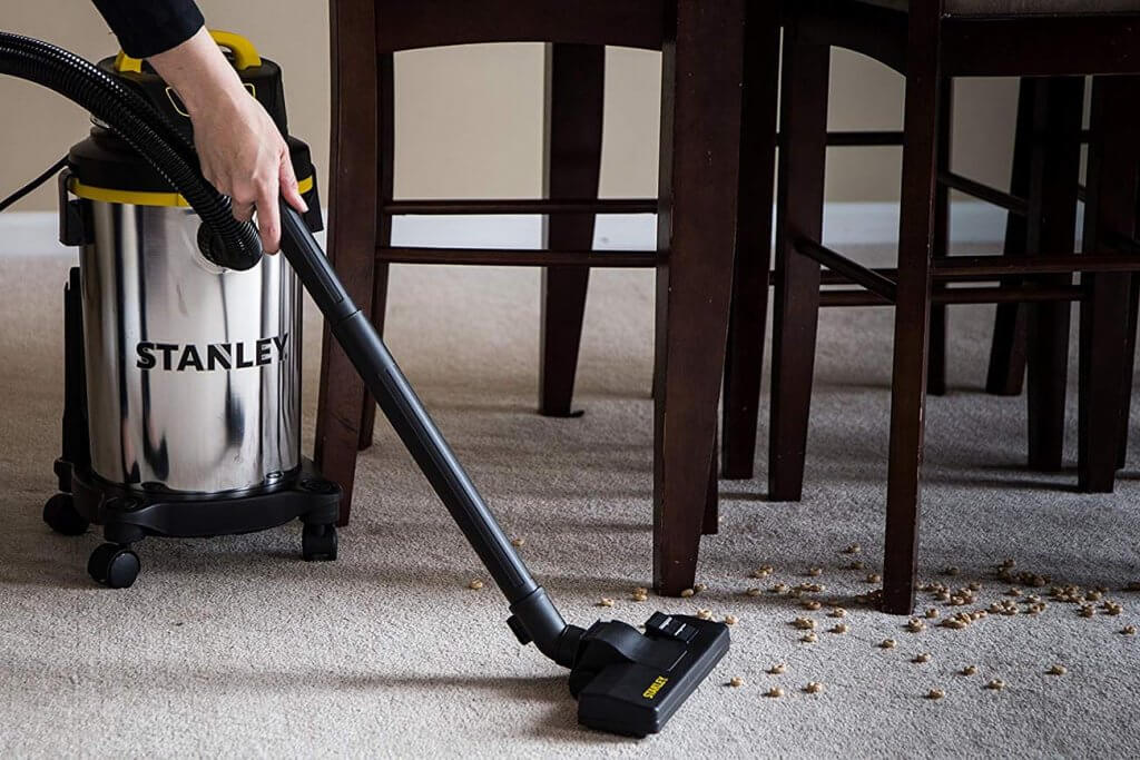 Cleaning a rug with the Stanley 4-Gallon 4.0 HP