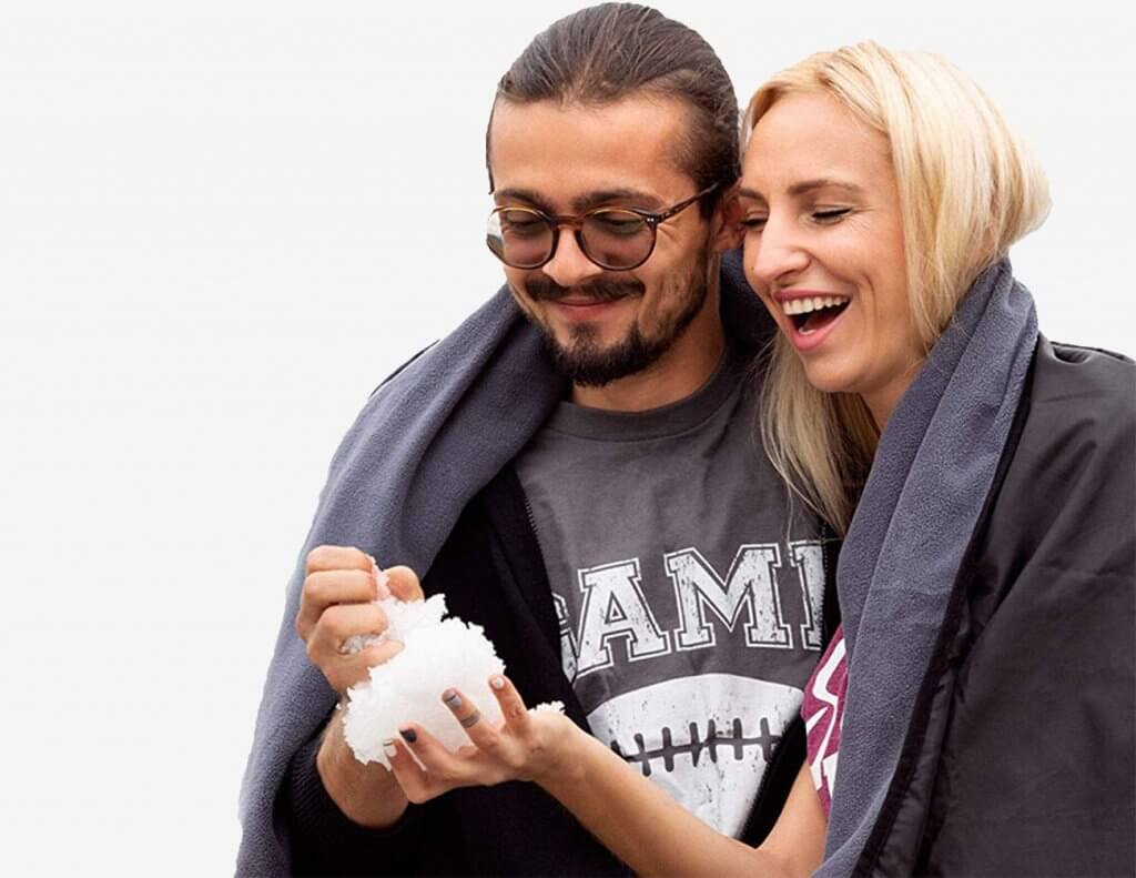 Couple using the SuitedNomad Outdoor Stadium Blanket