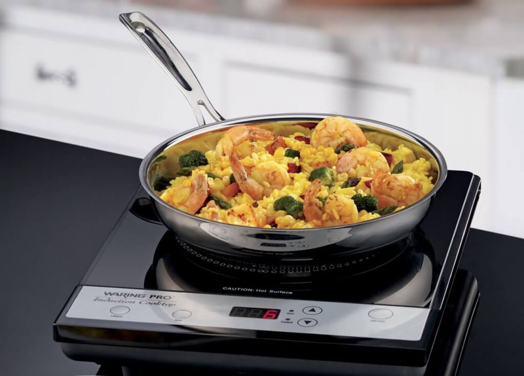 preparing chicken paella in the Waring Pro ICT200